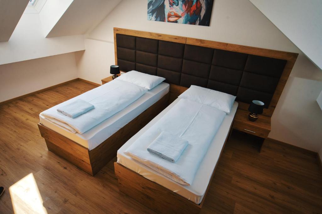 Posteľ alebo postele v izbe v ubytovaní M-24 Apartments