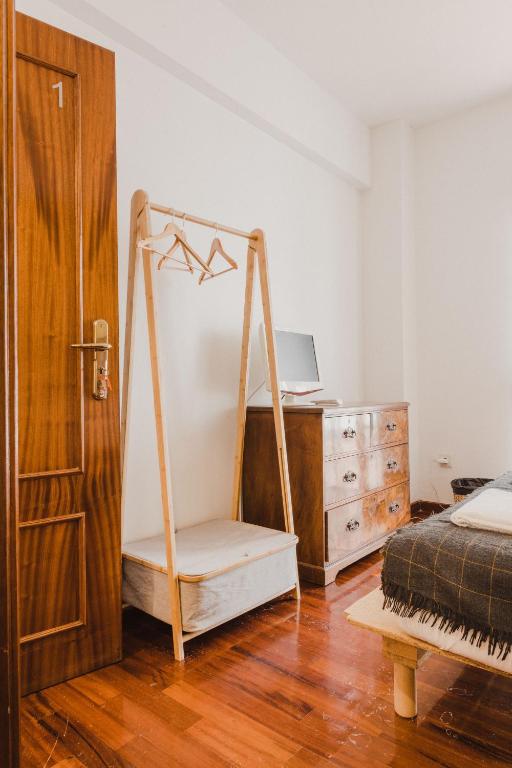 Postel nebo postele na pokoji v ubytování Jaca Hostel Porto da Cruz