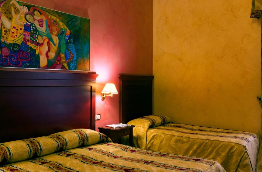 Postel nebo postele na pokoji v ubytování Hotel Joli