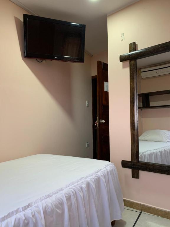 Postel nebo postele na pokoji v ubytování Hotel La Barca