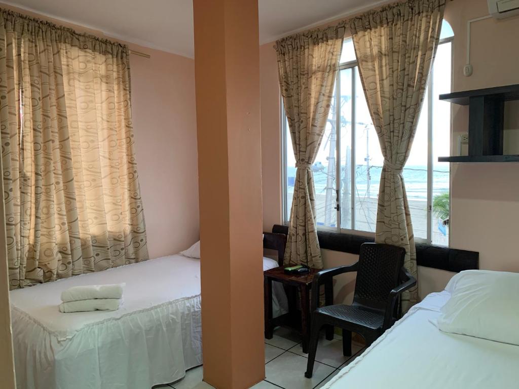 Postel nebo postele na pokoji v ubytování Hotel La Barca