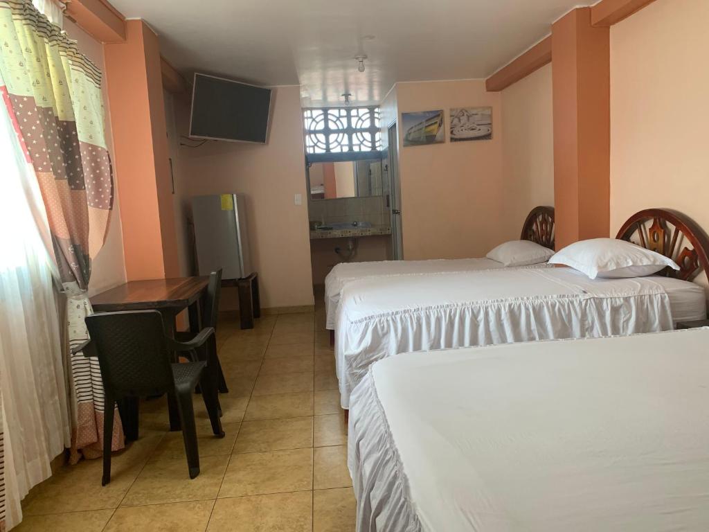 Postel nebo postele na pokoji v ubytování Hotel La Barca