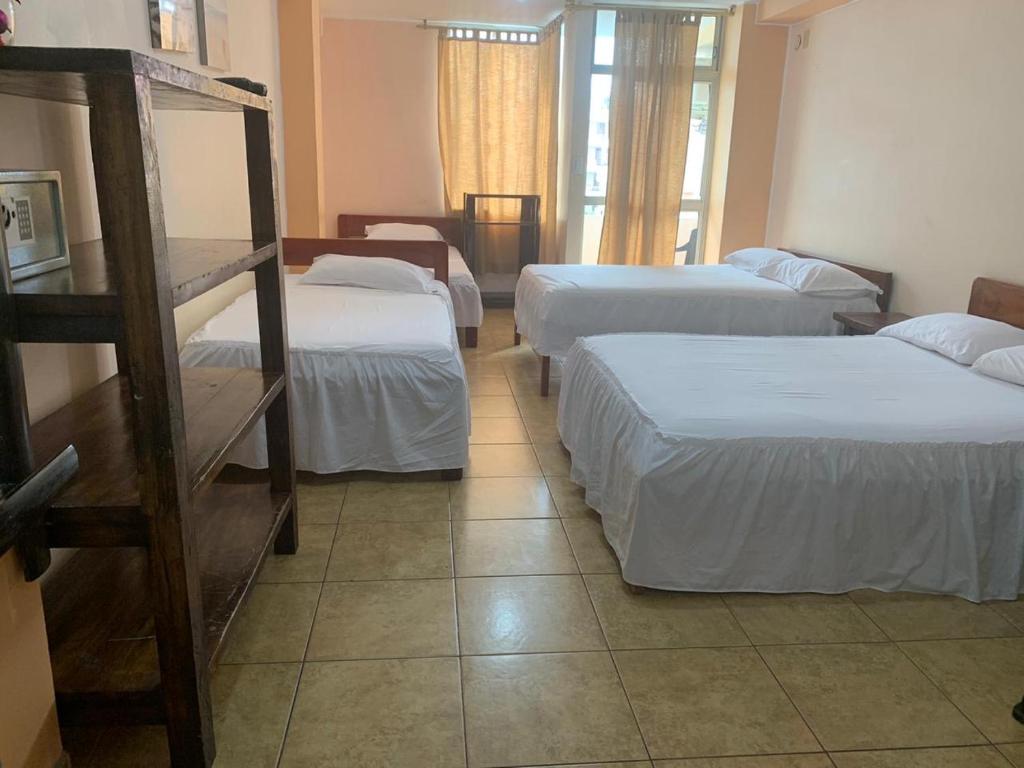 Postel nebo postele na pokoji v ubytování Hotel La Barca