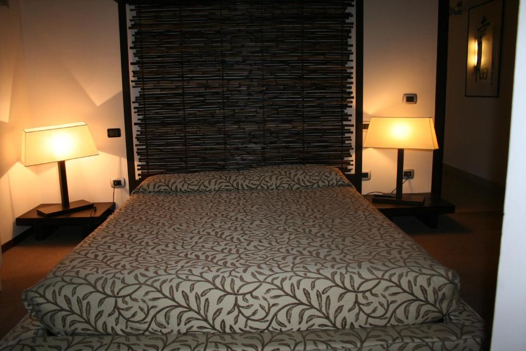 Postel nebo postele na pokoji v ubytování Hotel Residence Ristorante Ramandolo