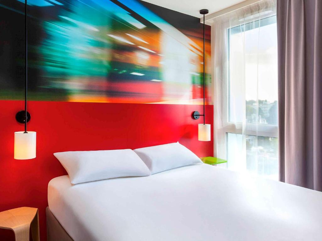 Postel nebo postele na pokoji v ubytování Ibis Styles Mulhouse Centre Gare
