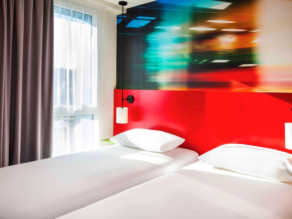 Postel nebo postele na pokoji v ubytování Ibis Styles Mulhouse Centre Gare