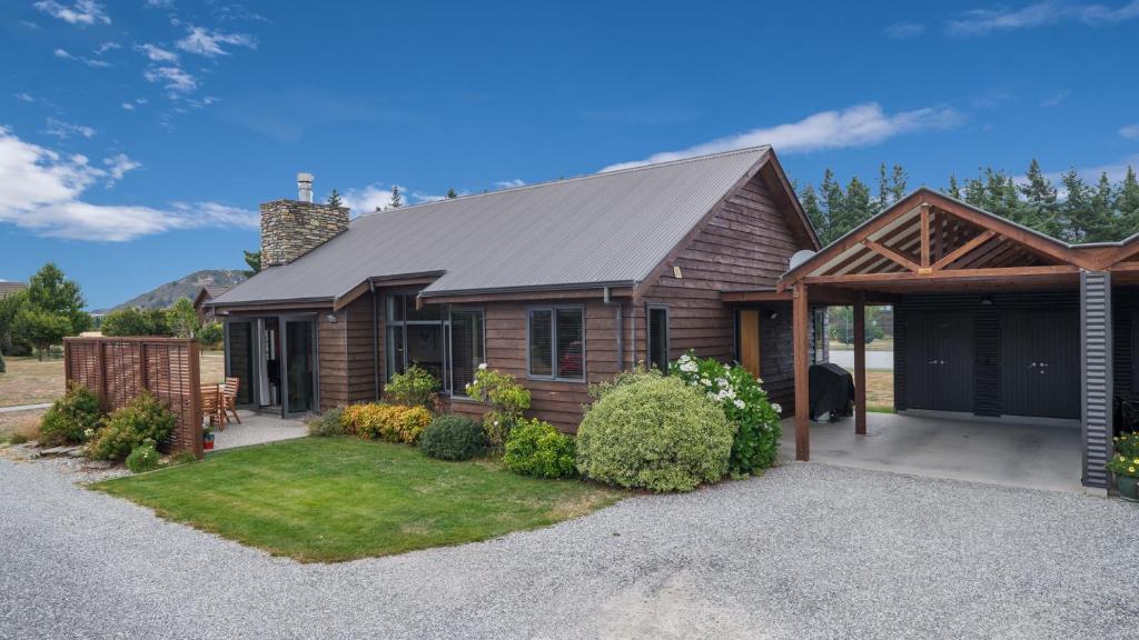 a house with a gambrel roof at Heritage Village - Villa #5 in Wanaka