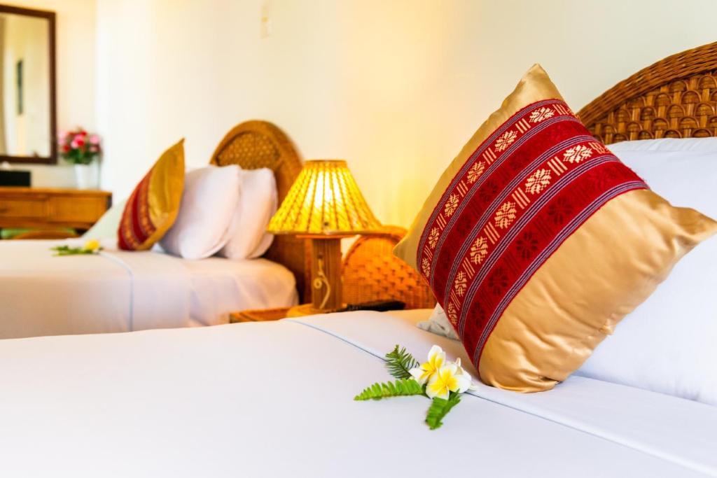 Giường trong phòng chung tại White Sand Resort Mui Ne