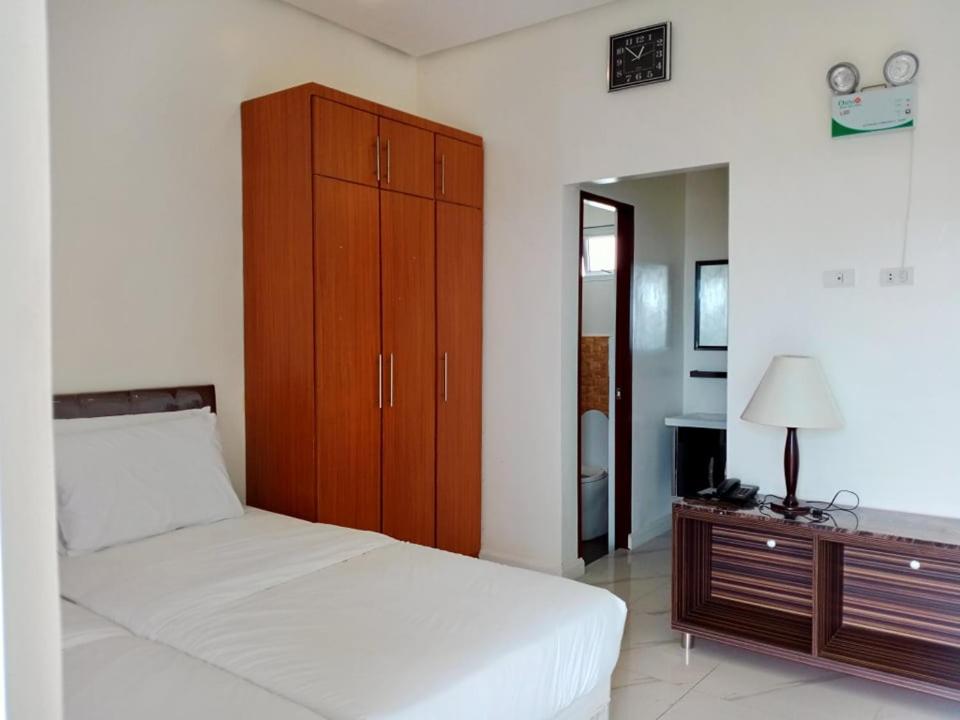 Postel nebo postele na pokoji v ubytování Centtro Residences