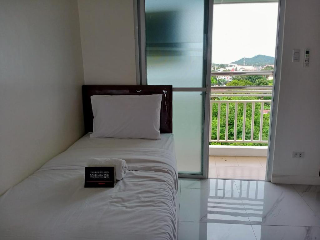 Postel nebo postele na pokoji v ubytování Centtro Residences