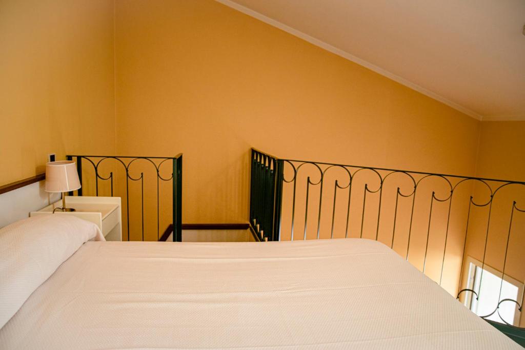 A bed or beds in a room at Hotel San Genesio