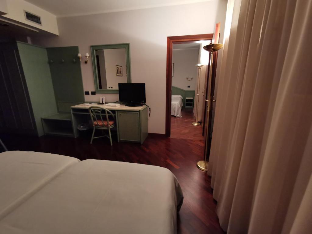 Postel nebo postele na pokoji v ubytování Hotel Le Ville