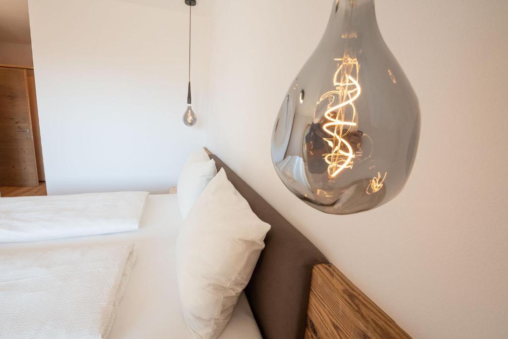 Łóżko lub łóżka w pokoju w obiekcie Apt Eiche - Nockerhof