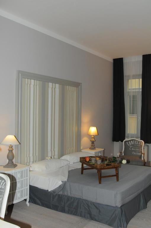 Postel nebo postele na pokoji v ubytování Locanda In Borgo Garnì & Wellness