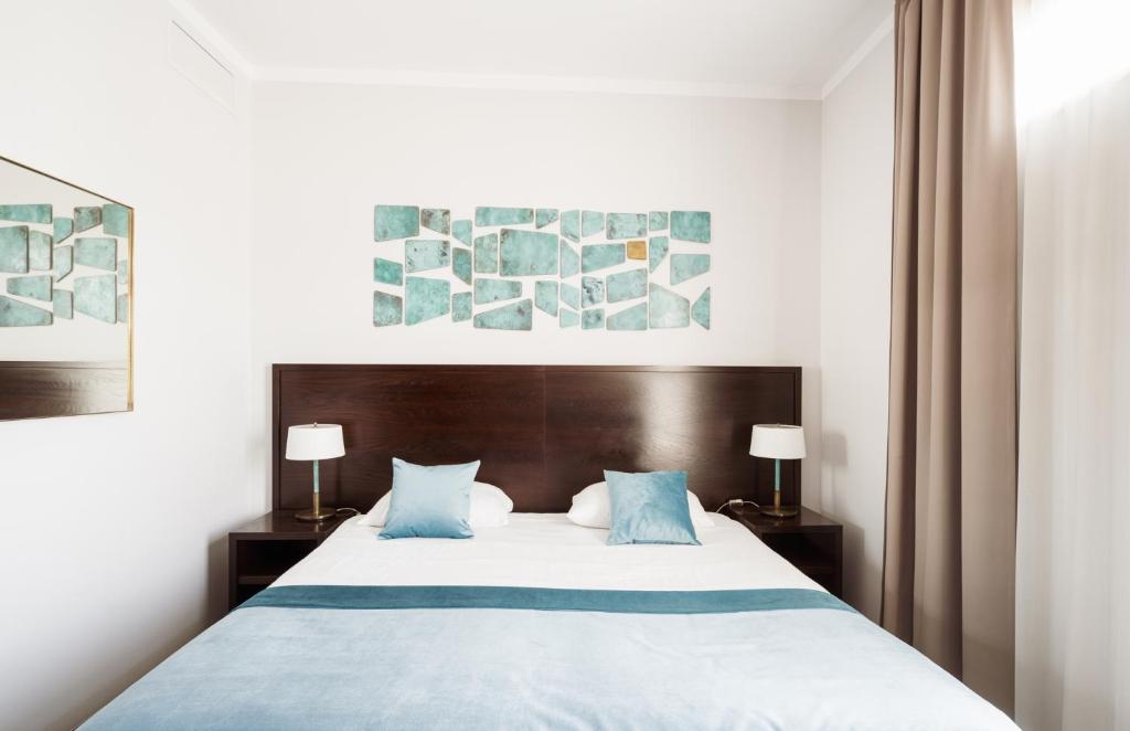Posteľ alebo postele v izbe v ubytovaní Europeum Hotel