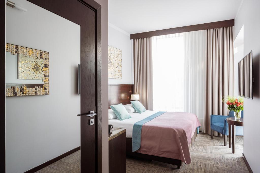 Posteľ alebo postele v izbe v ubytovaní Europeum Hotel