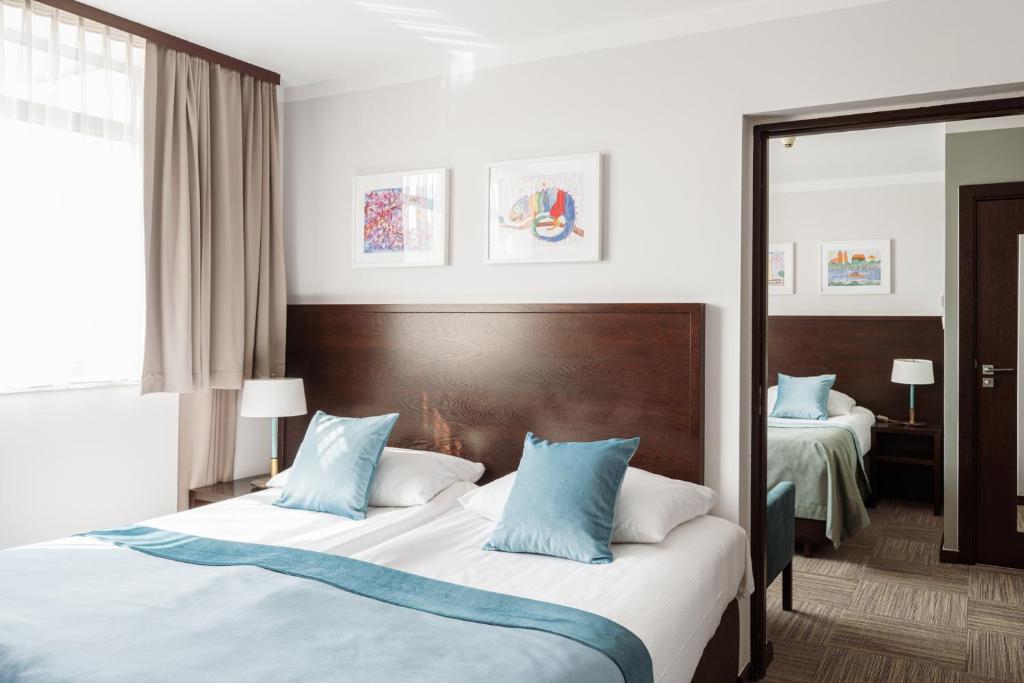 Posteľ alebo postele v izbe v ubytovaní Europeum Hotel