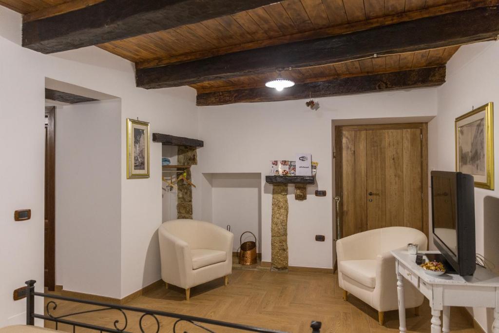Televízia a/alebo spoločenská miestnosť v ubytovaní Casa Vacanze Porta Manfredi