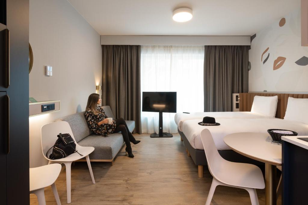 TV a/nebo společenská místnost v ubytování Adagio access Brussels Delta