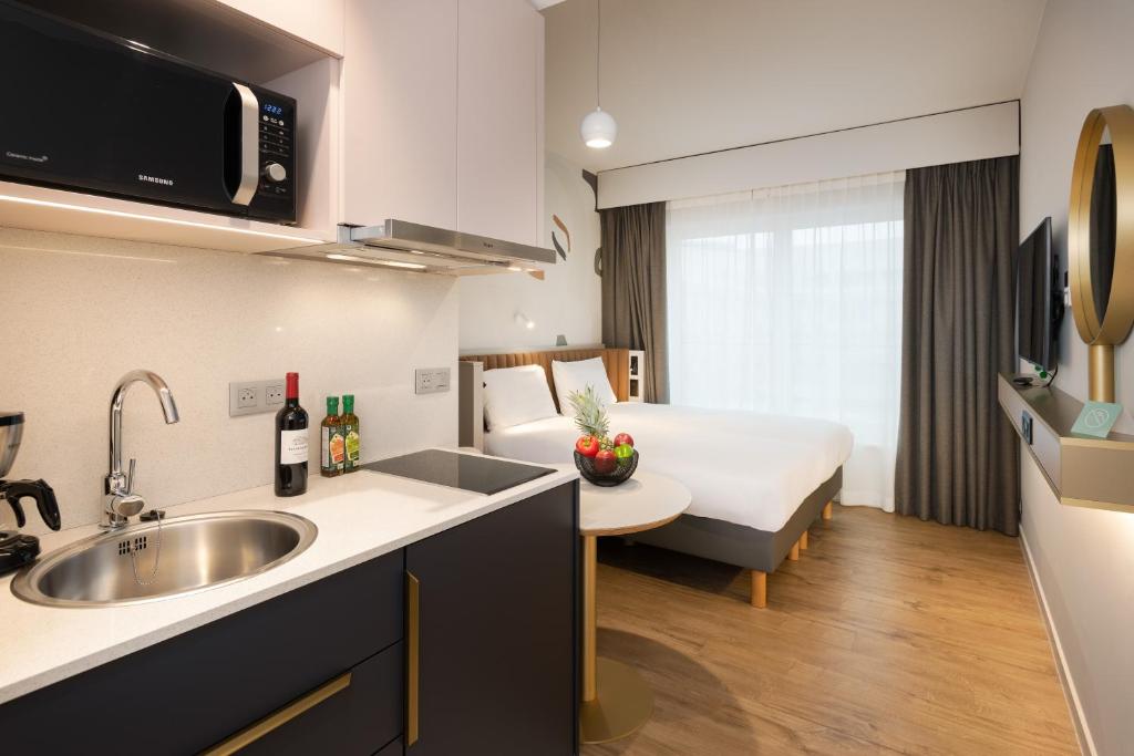 Kuchyň nebo kuchyňský kout v ubytování Adagio access Brussels Delta