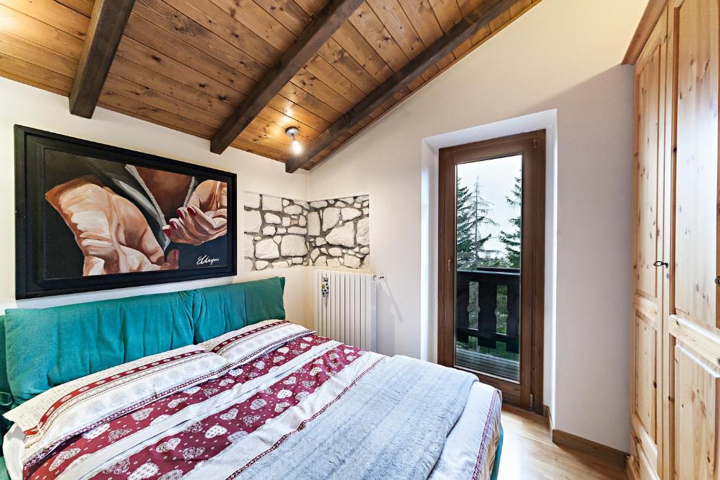 Postel nebo postele na pokoji v ubytování Chalet Mirastelle
