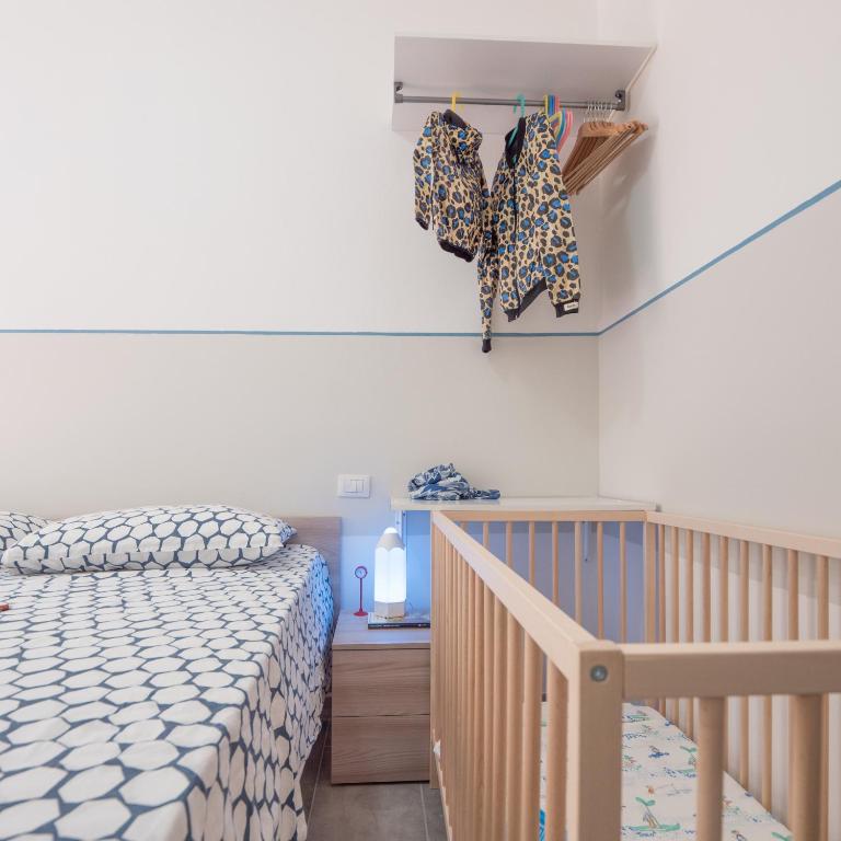 Łóżko lub łóżka w pokoju w obiekcie Babyaccommodation Family Panoramic II