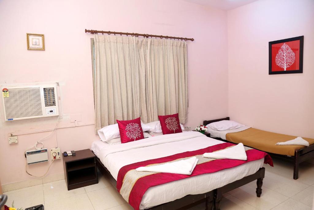 Postel nebo postele na pokoji v ubytování DAFFODILS SERVICED APARTMENT