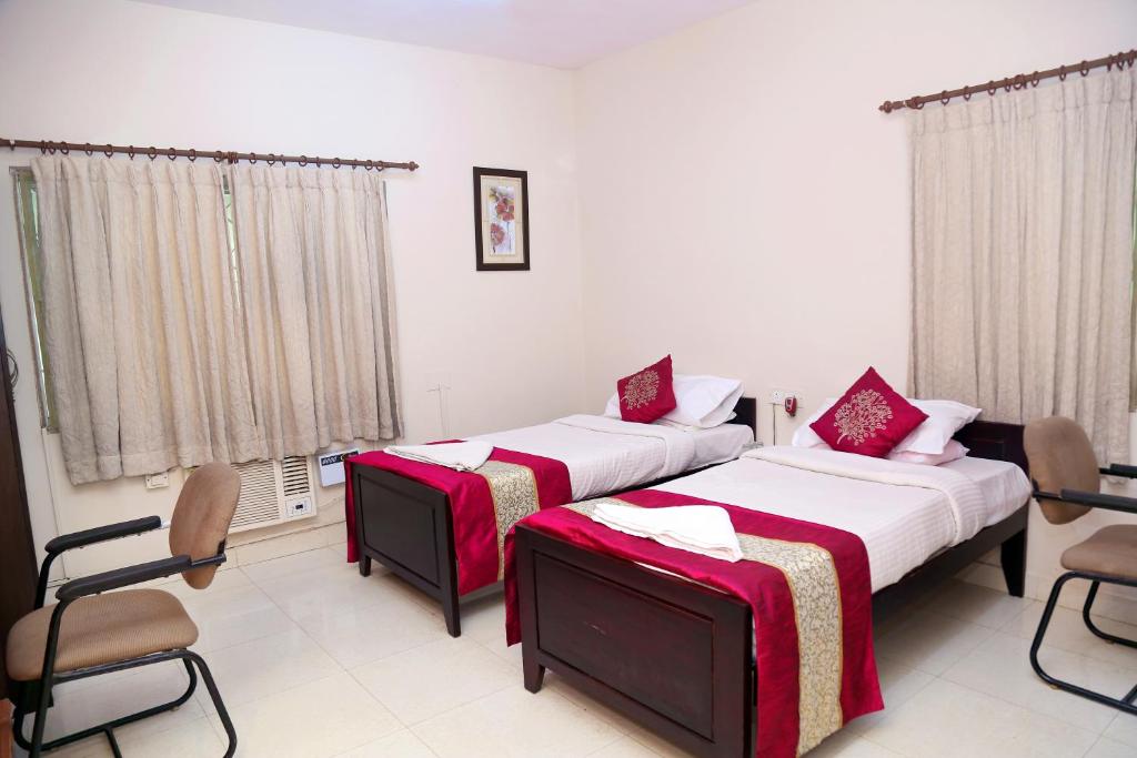 Postel nebo postele na pokoji v ubytování DAFFODILS SERVICED APARTMENT