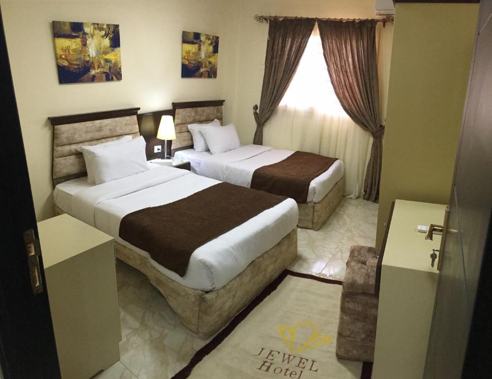 Postel nebo postele na pokoji v ubytování Jewel Gameel appartement