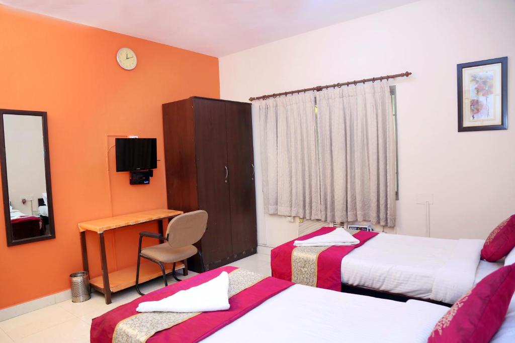 Postel nebo postele na pokoji v ubytování DAFFODILS SERVICED APARTMENT