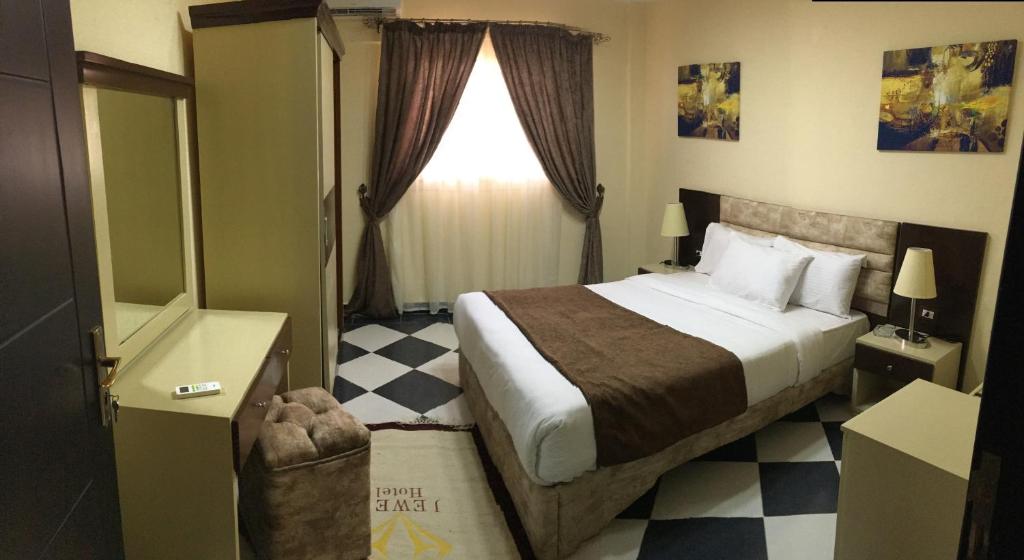 Postel nebo postele na pokoji v ubytování Jewel Gameel appartement