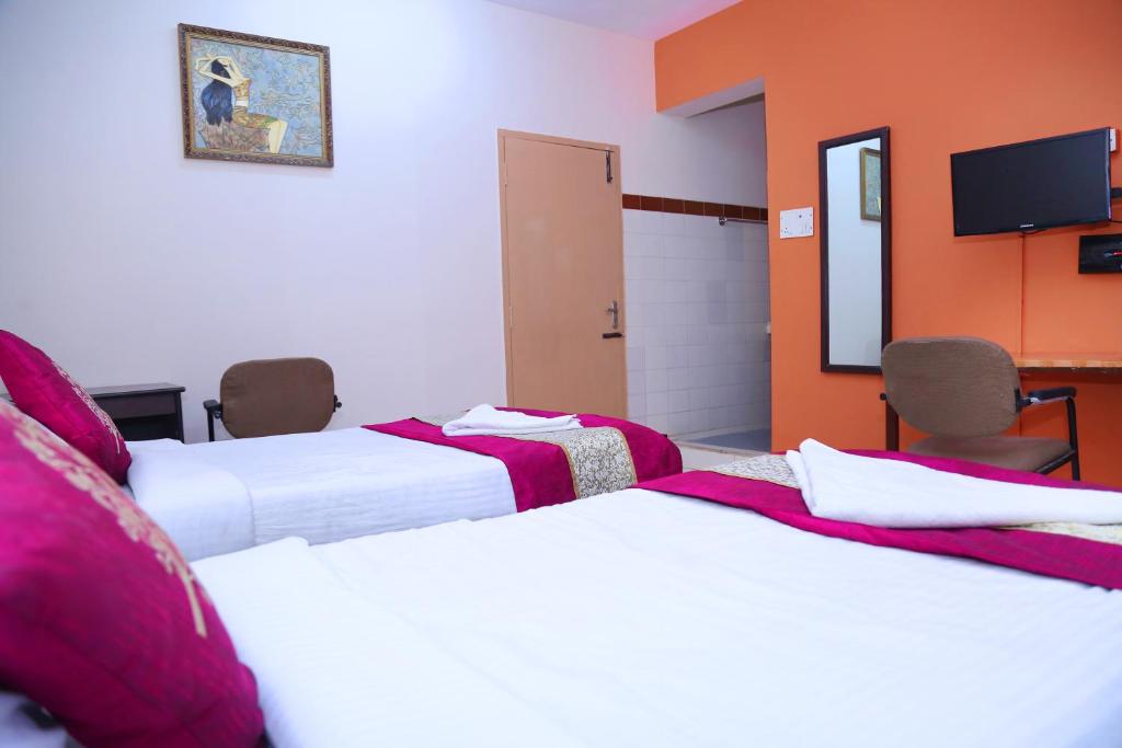 Postel nebo postele na pokoji v ubytování DAFFODILS SERVICED APARTMENT