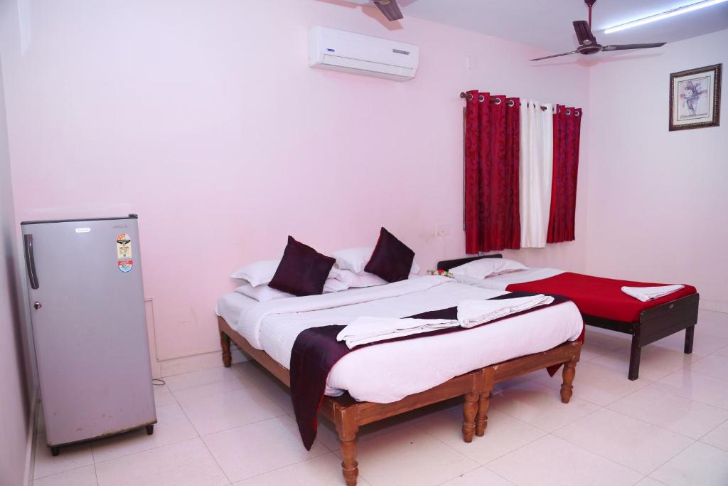 Postel nebo postele na pokoji v ubytování DAFFODILS SERVICED APARTMENT