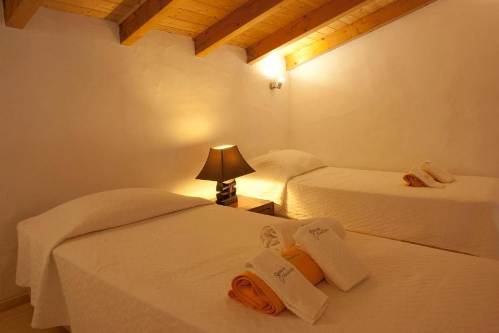 Postel nebo postele na pokoji v ubytování Quinta do Chocalhinho Agroturismo & SPA