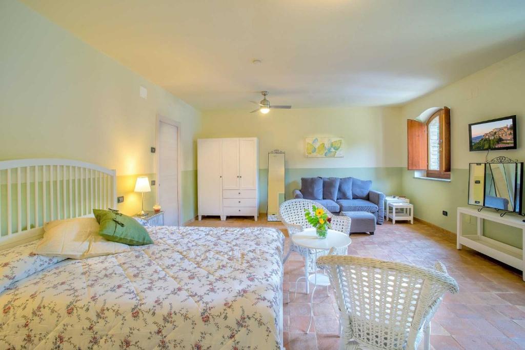 Posteľ alebo postele v izbe v ubytovaní Torrenova di Assisi Country House