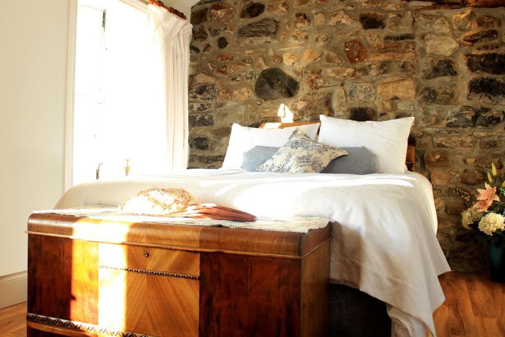 Postel nebo postele na pokoji v ubytování Les Ancêtres Auberge & Restaurant
