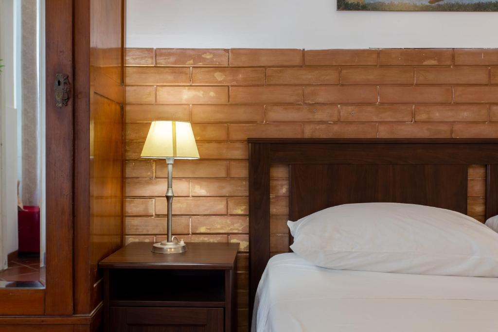 A bed or beds in a room at Le Dimore del Mito - Atalanta