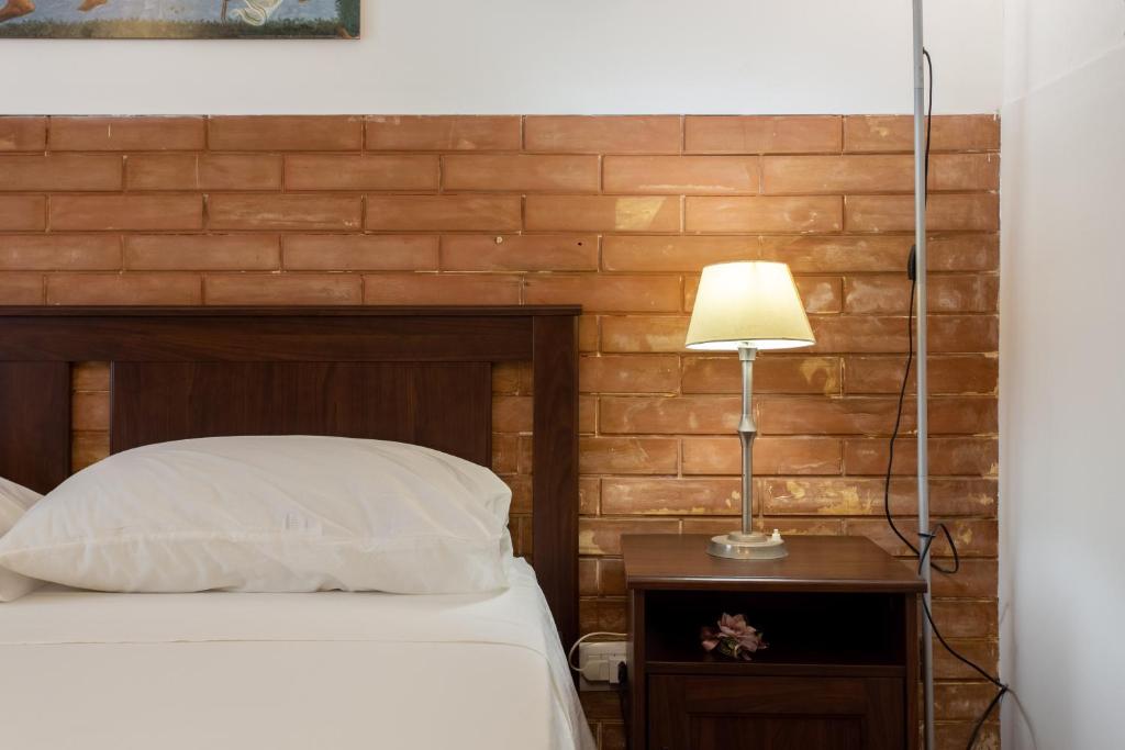 A bed or beds in a room at Le Dimore del Mito - Atalanta