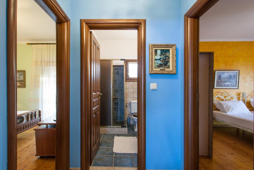 Postel nebo postele na pokoji v ubytování Aegean Sea Villa Skiathos