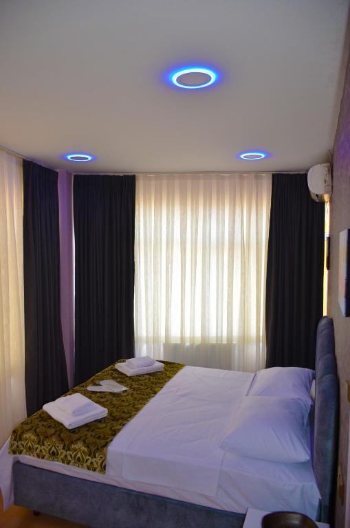 Postel nebo postele na pokoji v ubytování Rodion Hotel