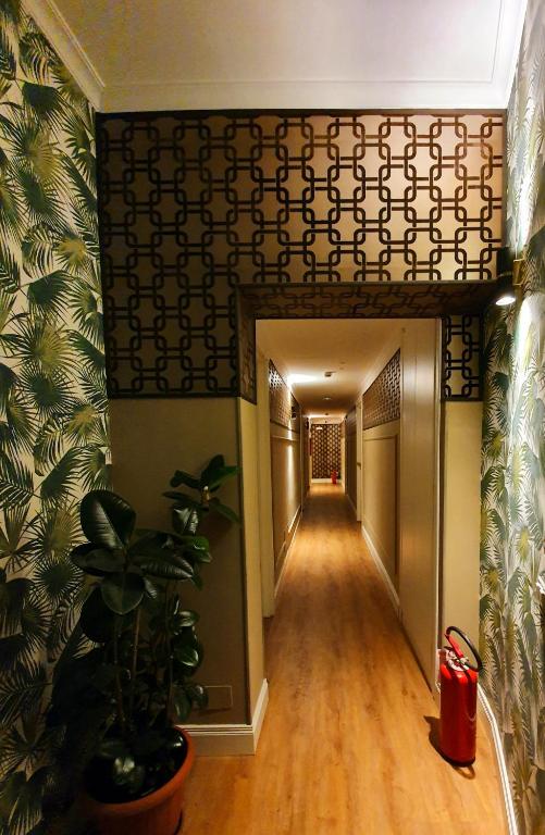 an empty hallway with a plant in a building at Hotel Coppede' in Rome