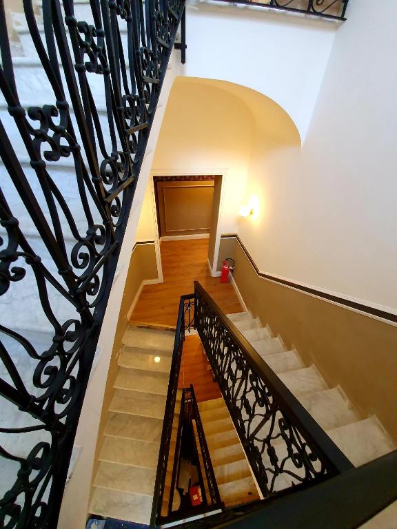 a staircase in a building with a railing at Hotel Coppede' in Rome