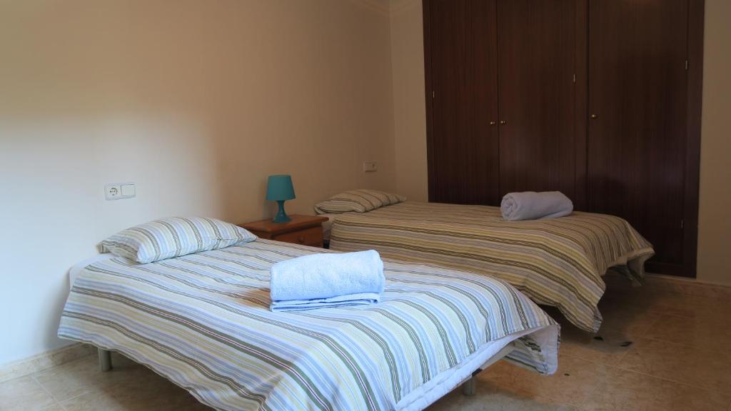 Ένα ή περισσότερα κρεβάτια σε δωμάτιο στο Casa Nova Regi