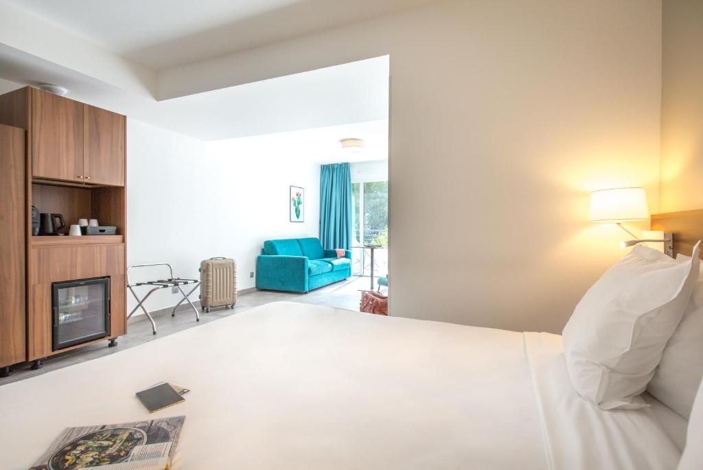 Postel nebo postele na pokoji v ubytování SOWELL HOTELS La Plage