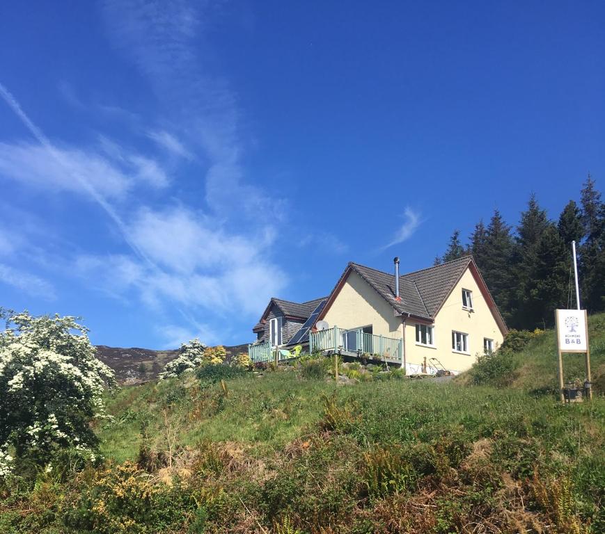 a house sitting on top of a hill at Achmore Self catering in Achmore