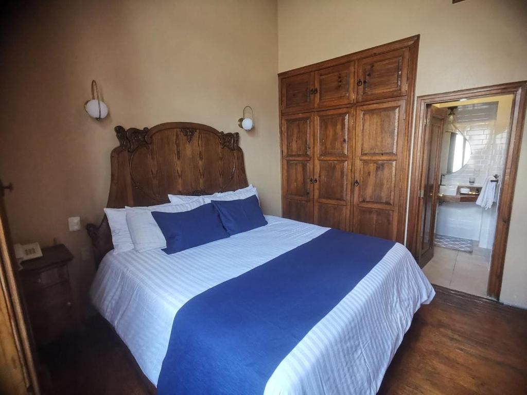 Postel nebo postele na pokoji v ubytování Hotel Boutique Casa de las Manrique