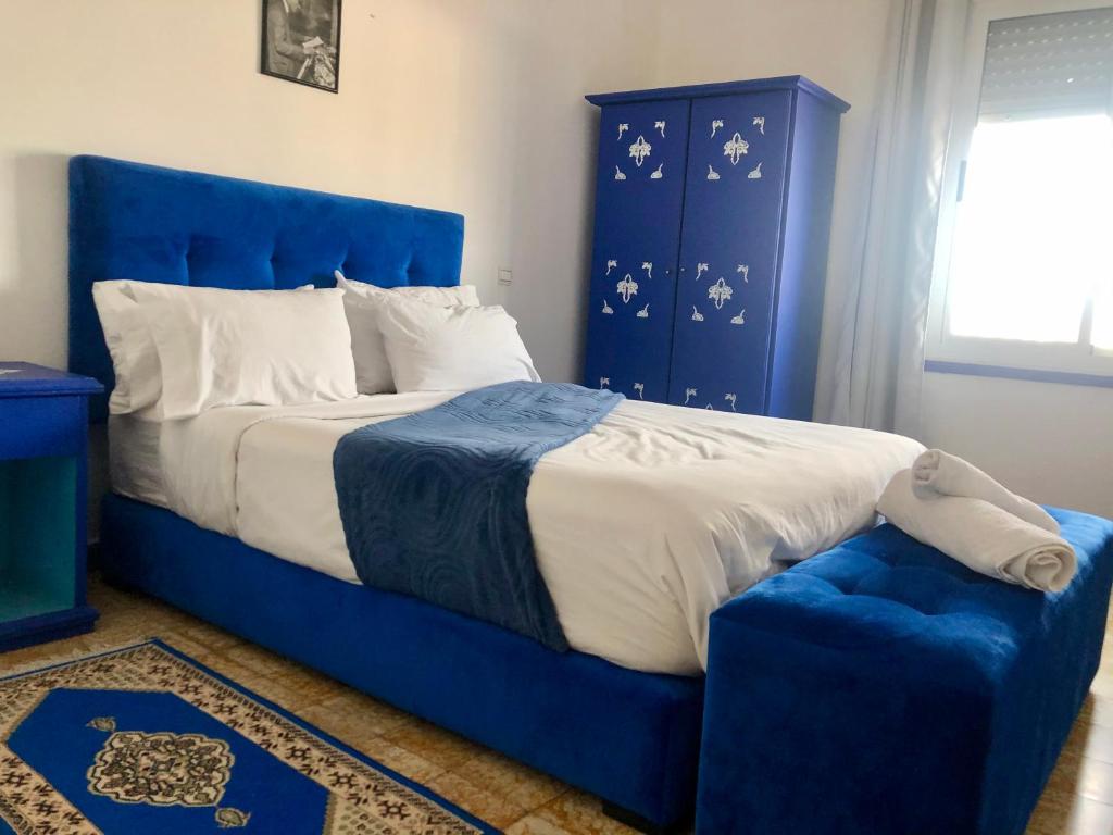 Postel nebo postele na pokoji v ubytování El Muniria