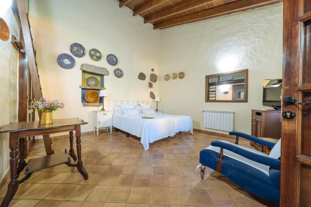 Postel nebo postele na pokoji v ubytování Hotel Rural Las Calas