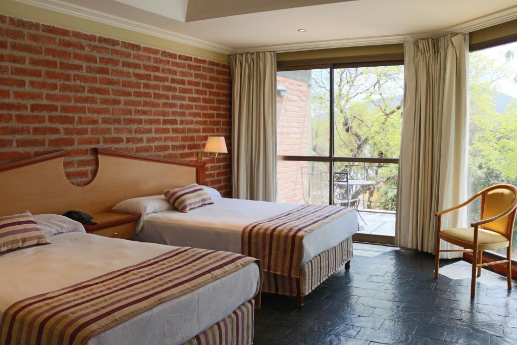 Кровать или кровати в номере Hotel Del Dique