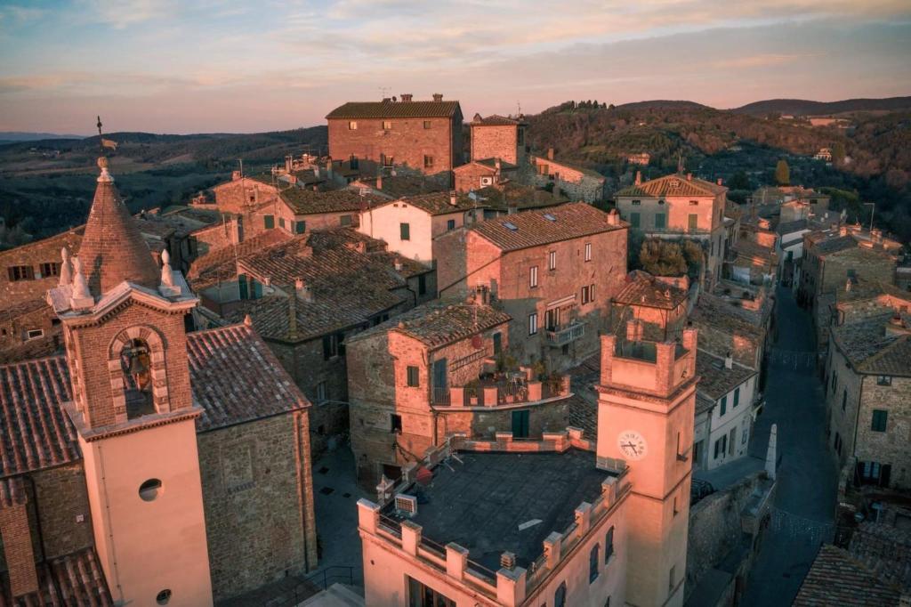 an aerial view of a town with buildings at Il Casone in Montisi